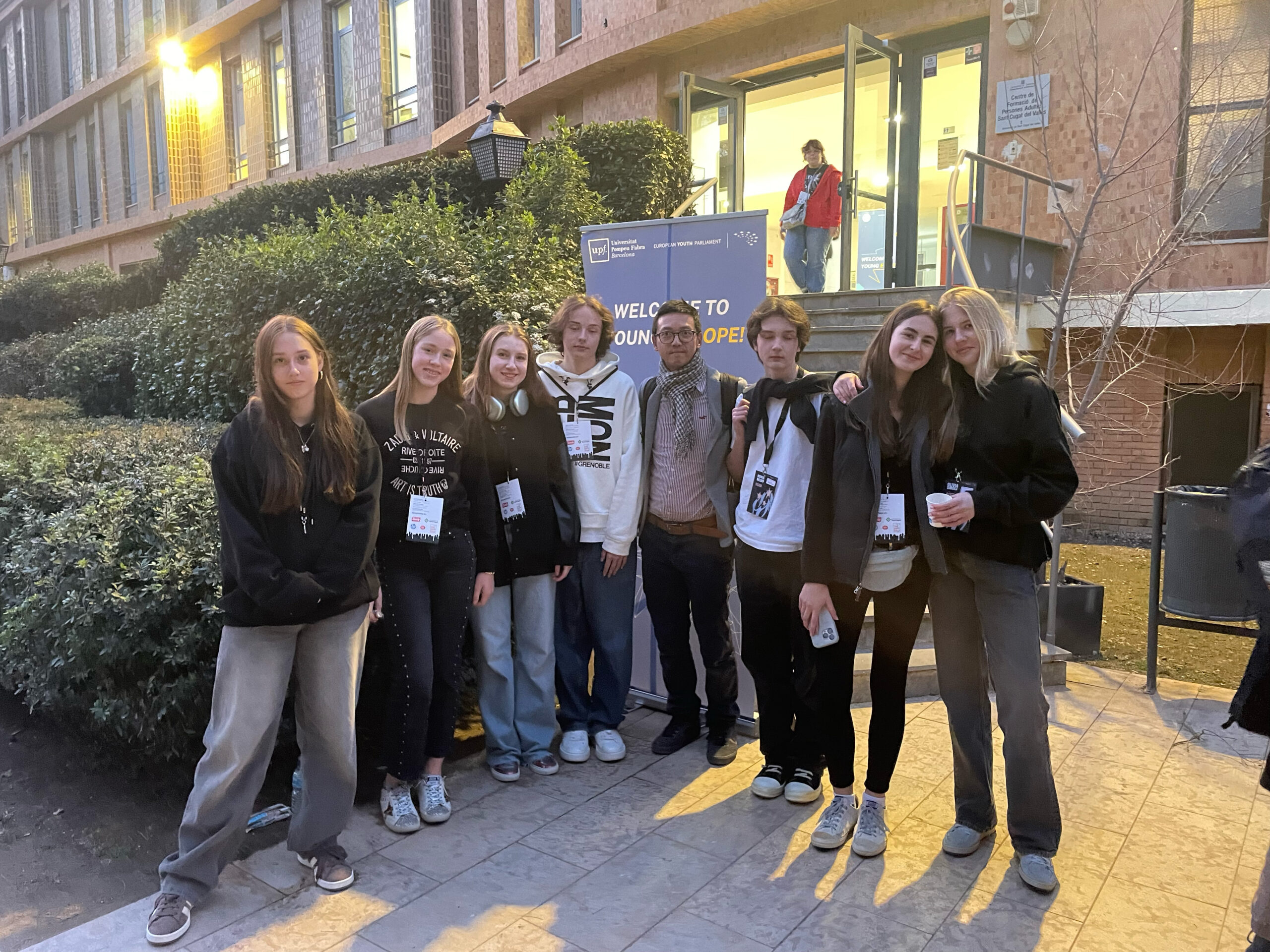 Students and their teacher participating in the European Youth Parliament, engaging in discussions and representing their school with enthusiasm and dedication.